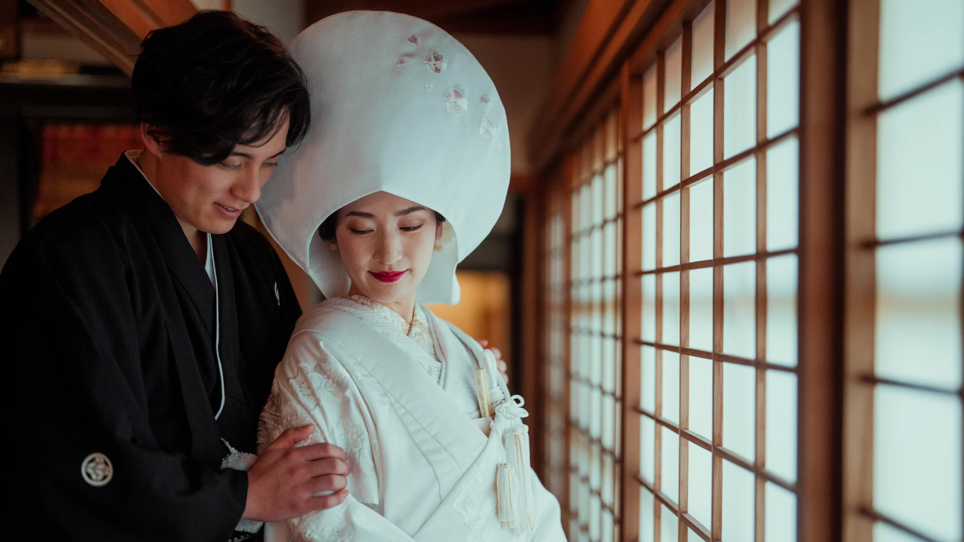 A traditional Shinto wedding ceremony at a Japanese shrine, showcasing the timeless elegance of the bride and groom in traditional attire.