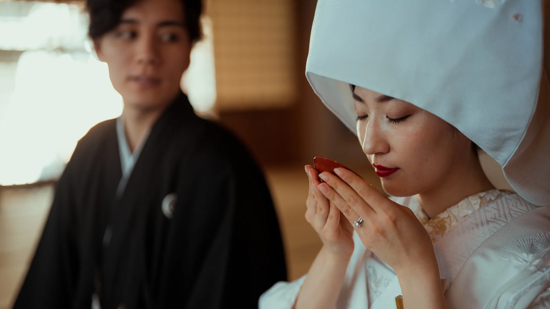 The San-San-Kudo ritual, where the couple shares sake in three sips, symbolizing unity and mutual respect.
