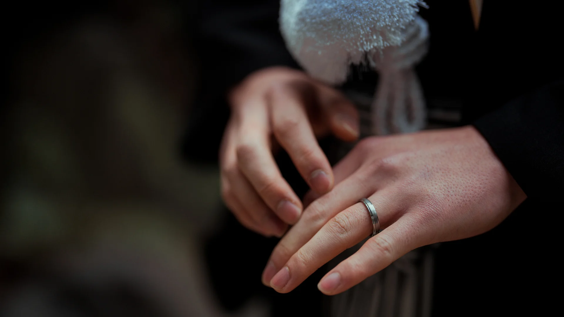 The couple exchanging rings, symbolizing their unbreakable bond and eternal vows.