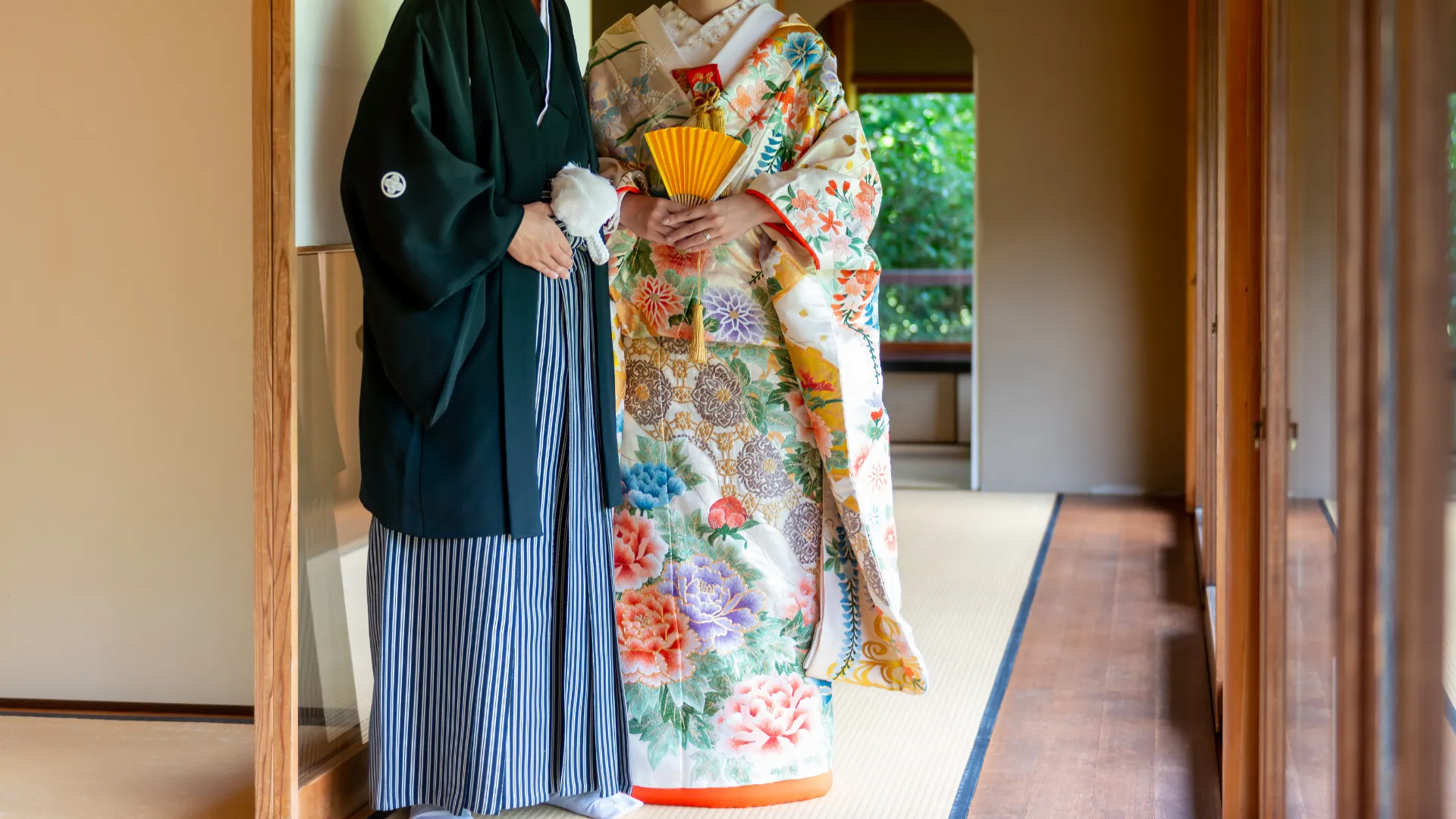 An iro-uchikake adorned with intricate embroidery, representing happiness and prosperity.