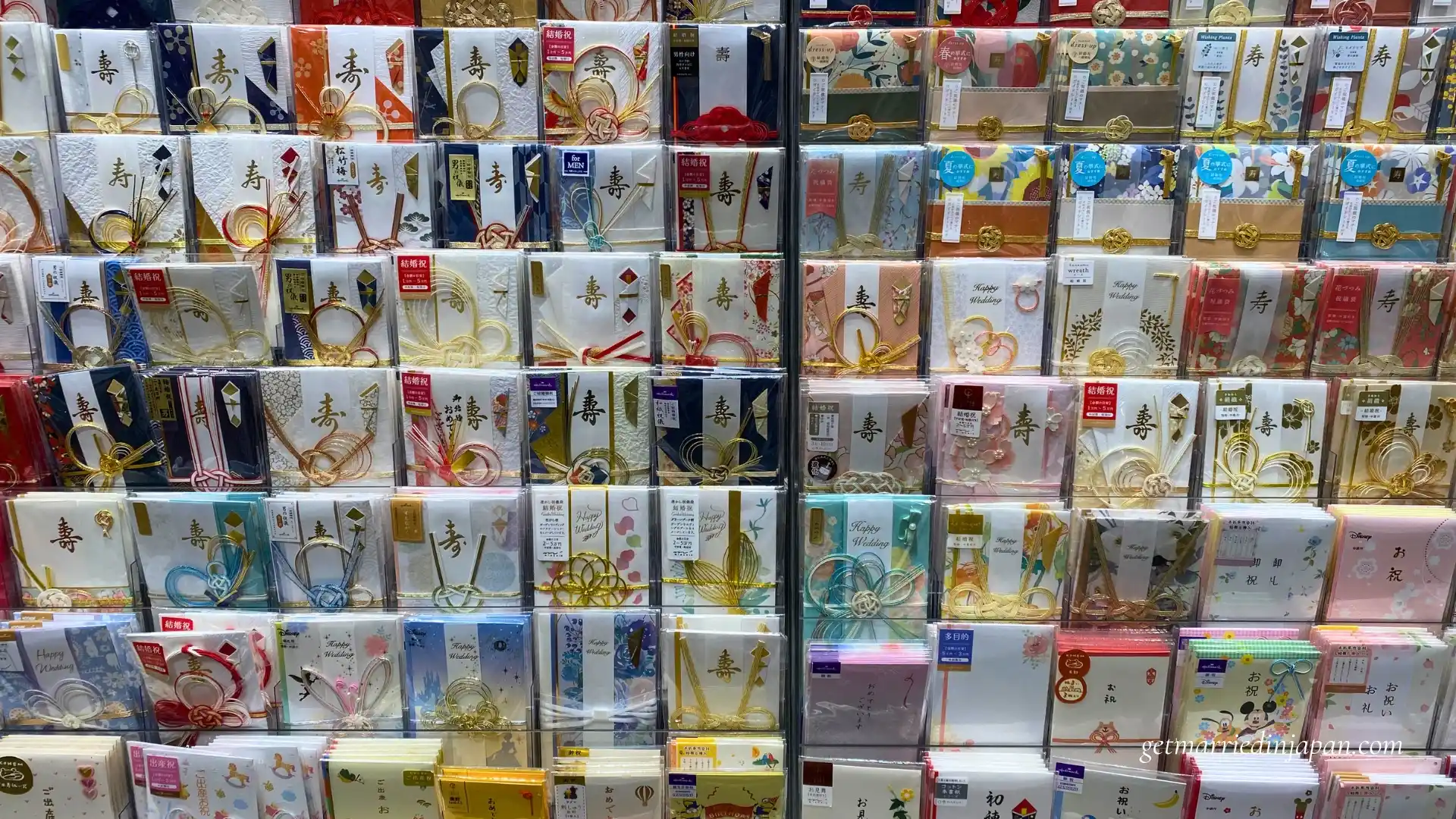 Colorful display of traditional Japanese goshugi bukuro (wedding money gift envelopes) on shelves at Tsutaya bookstore in Japan.