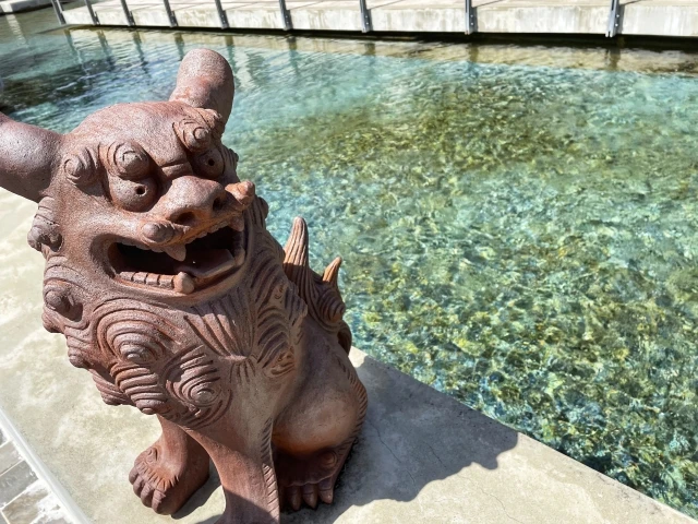 okinawa wedding shisa lion statue by clear water